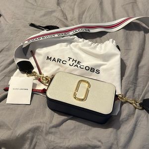 The Marc Jacobs Red White and Navy crossbody snapshot bag . Excellent condition